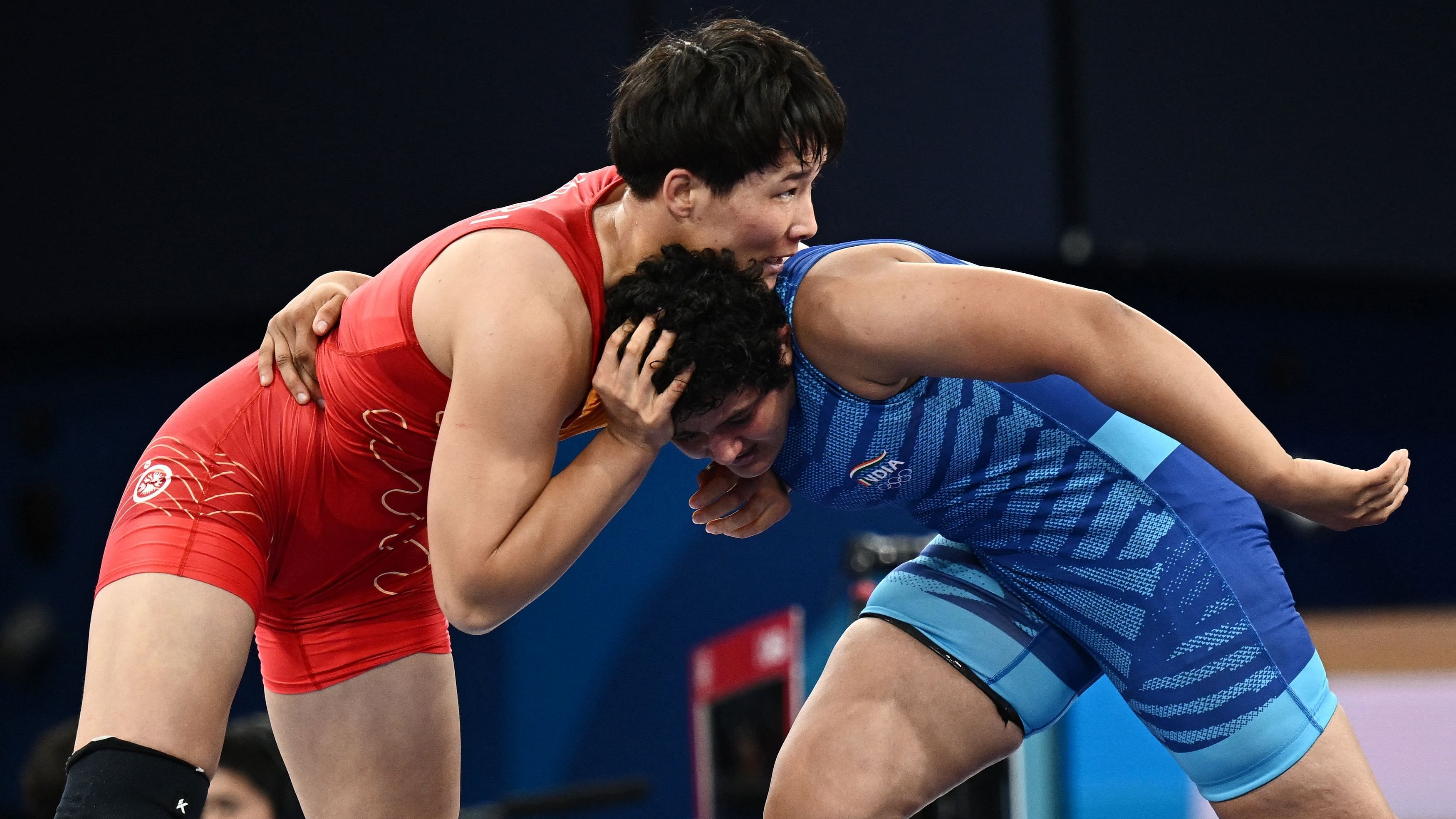 <div class="paragraphs"><p>Aiperi Medet Kyzy of Kyrgyzstan in action with Reetika Hooda of India.</p></div>